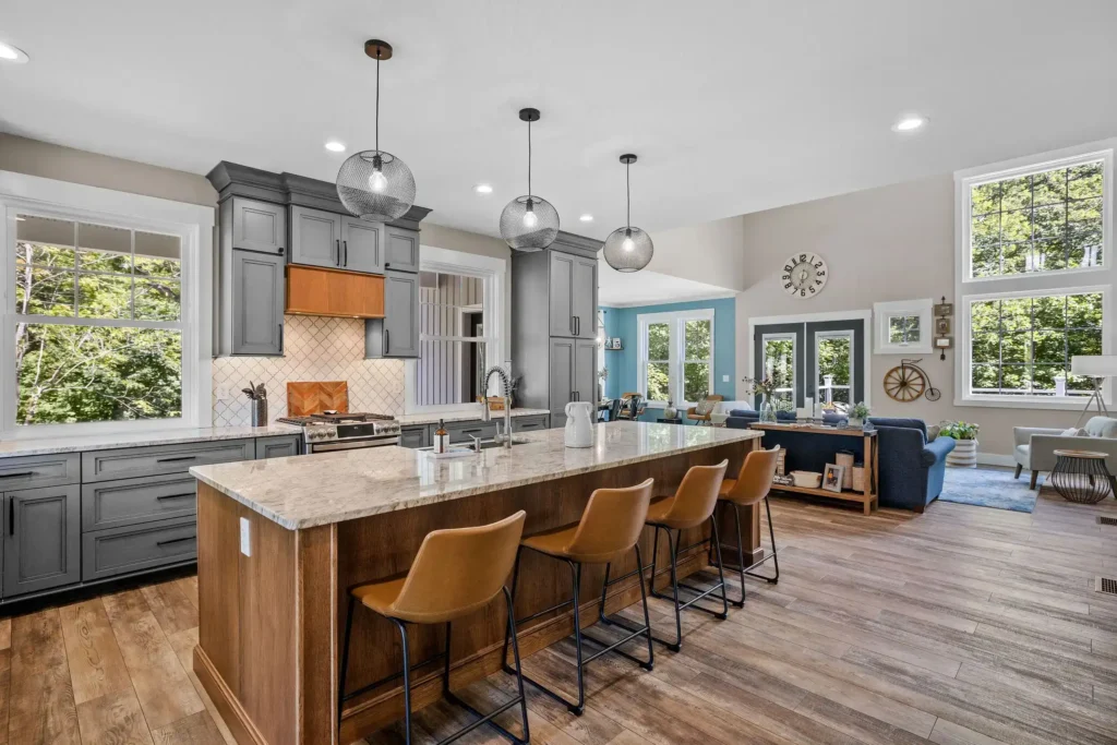 a beautiful kitchen with a large countertop and unique light bulbs decorations.